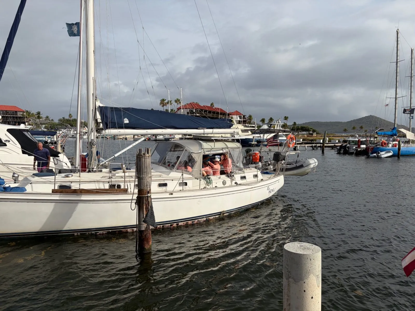 The troop's sailboat tied up at a marina