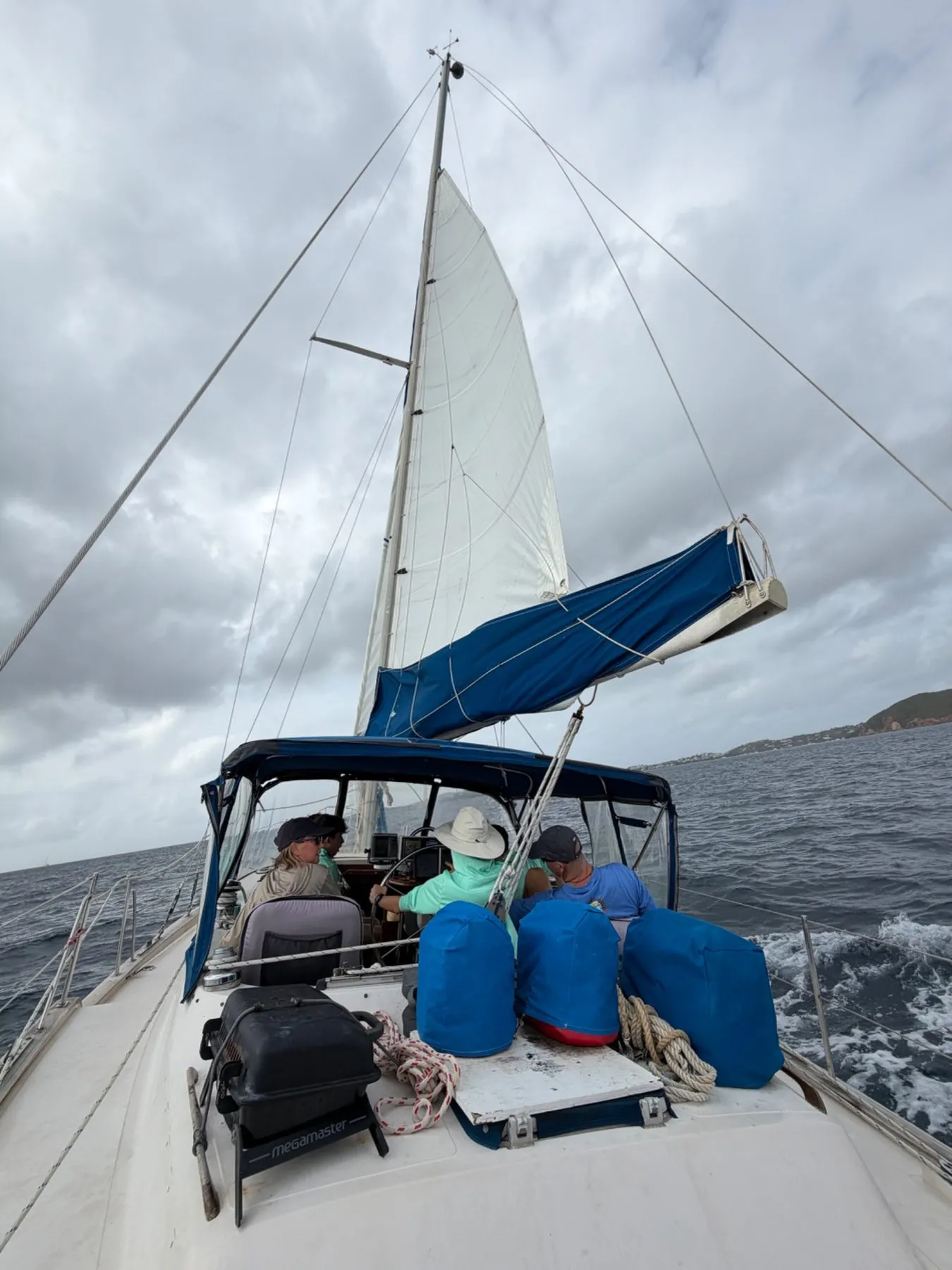 Scouts sailing a yacht offshore